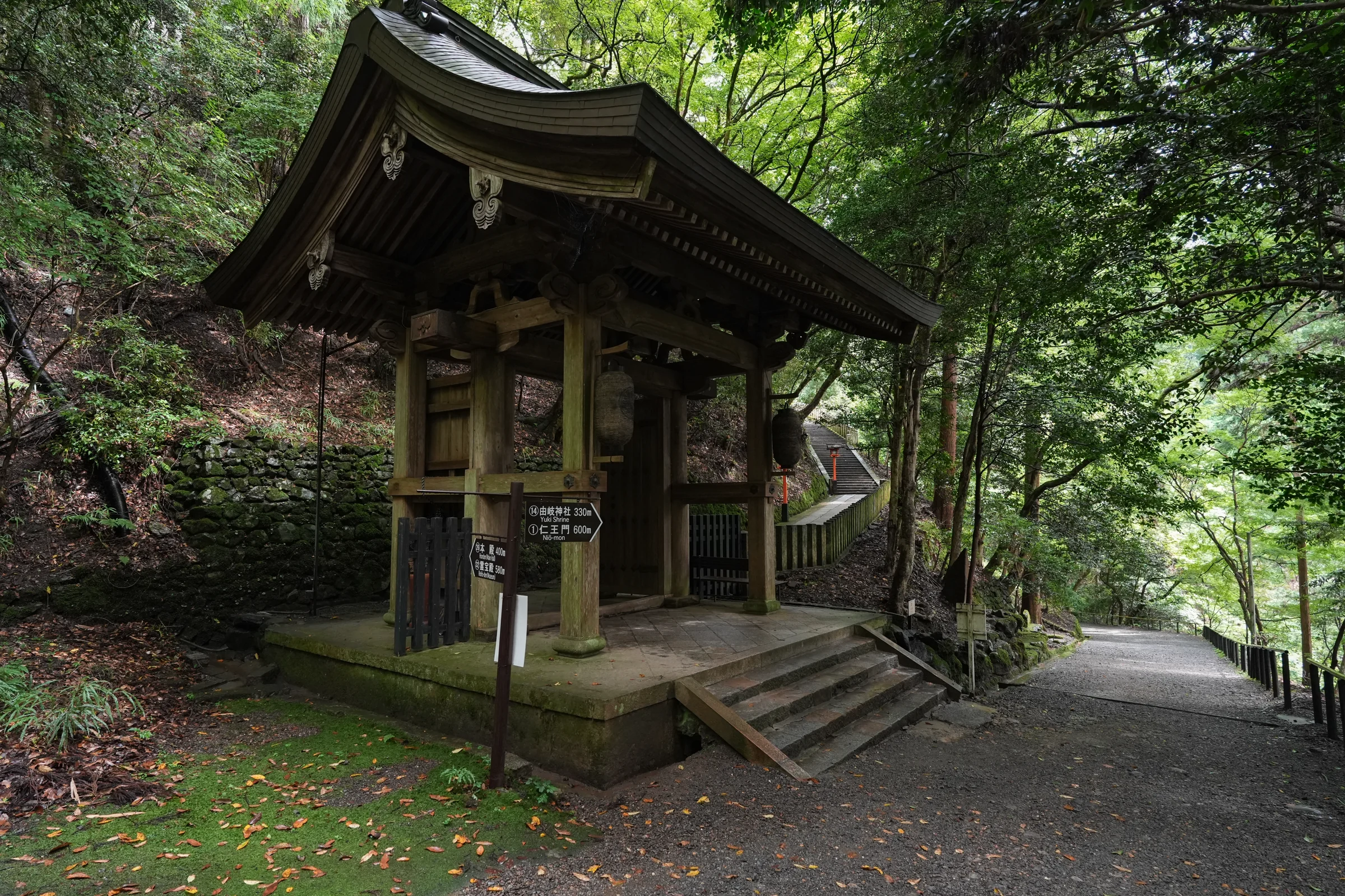 A small wooden hall beside the forest path on Mount Kurama.
